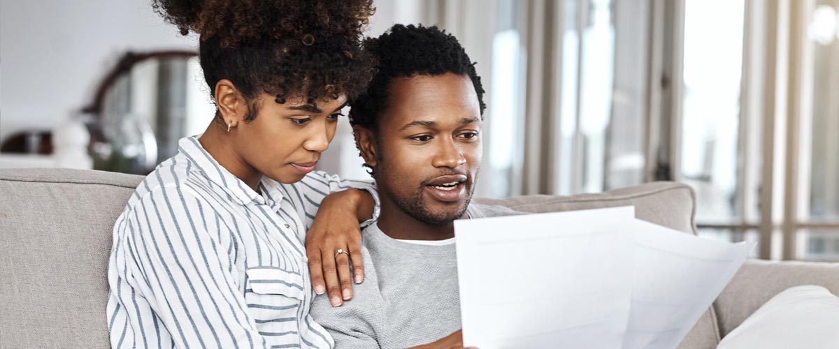 Photo of couple looking at documents